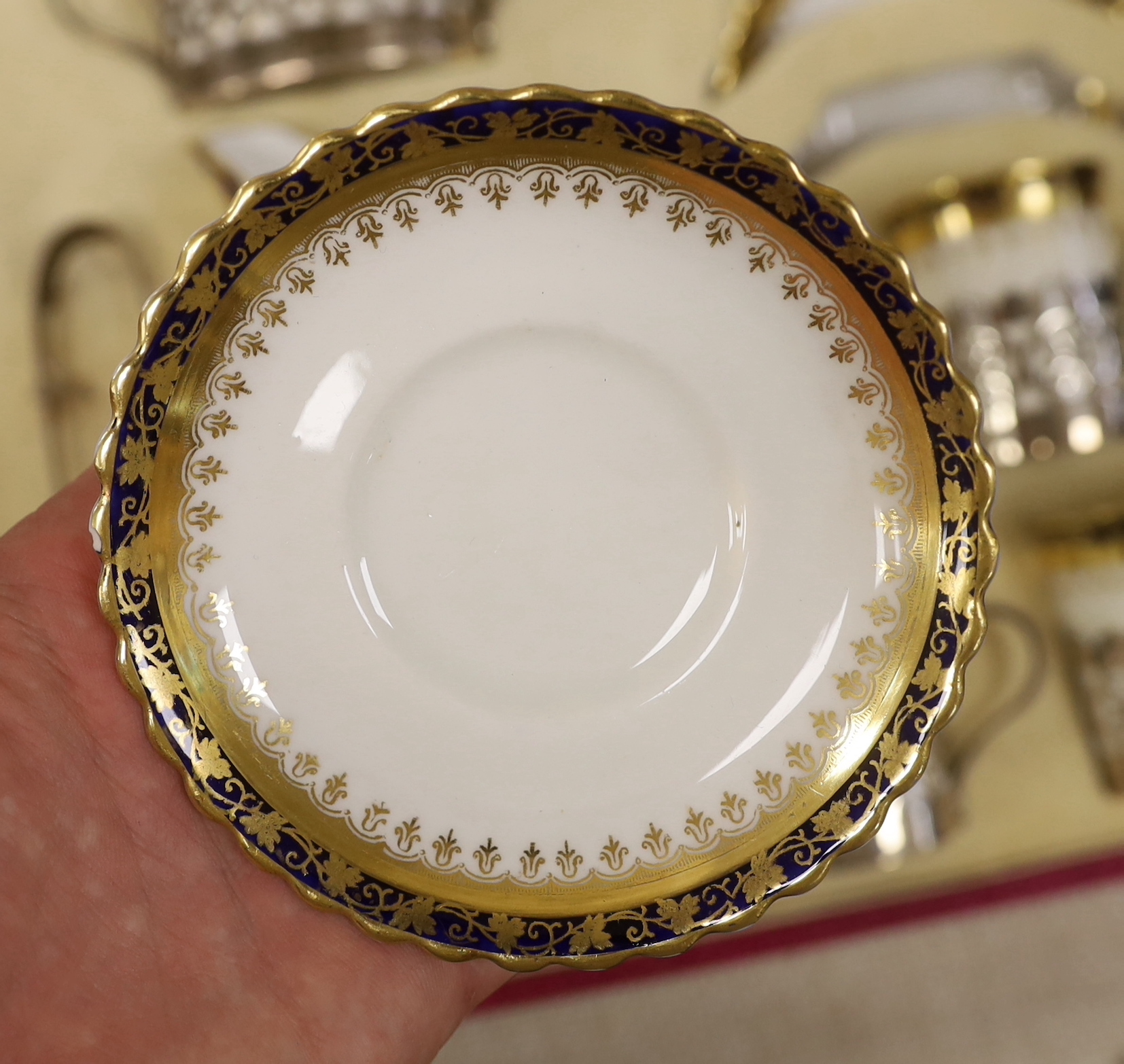 A cased George Jones Crescent China silver mounted coffee set, marks for Alexander Clark Co Ltd Sheffield 1928